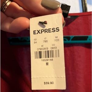 Express size medium….never worn. Great Holiday dress!